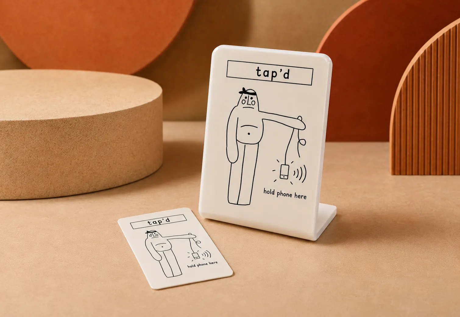 A tap'd card and stand carrying a one-off illustration